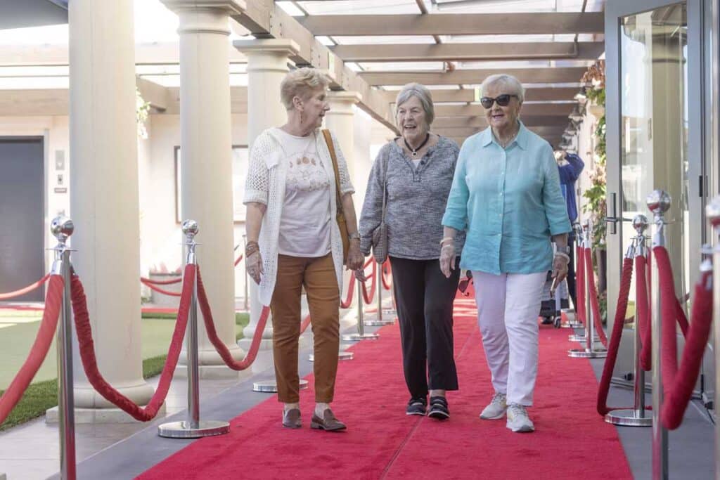 Residents and guests walk the red carpet at the Red Carpet Speaker Event.