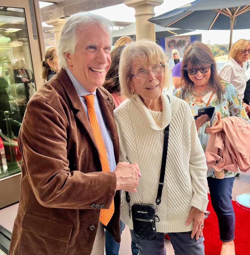 Henry Winkler 1 Henry Winkler posing for photos with residents and guests at the Red Carpet Speaker event.